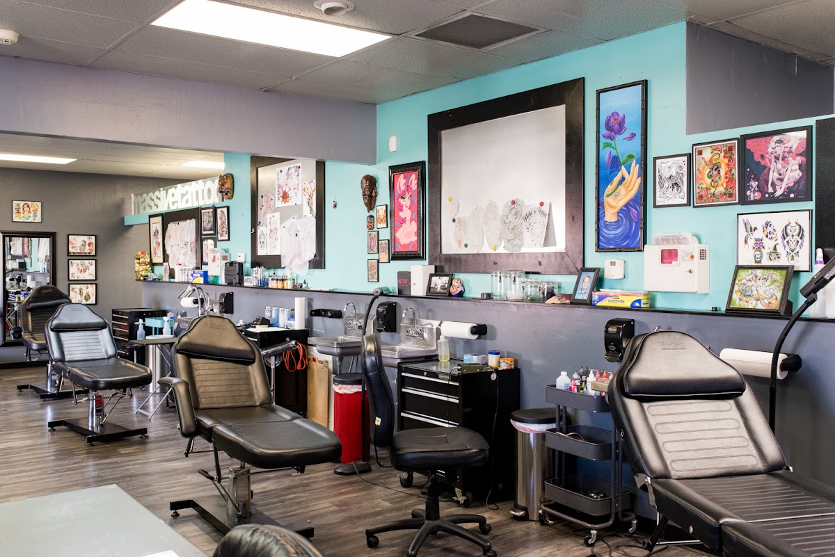 Massive Tattoo Studio full interior with multiple stations and artwork